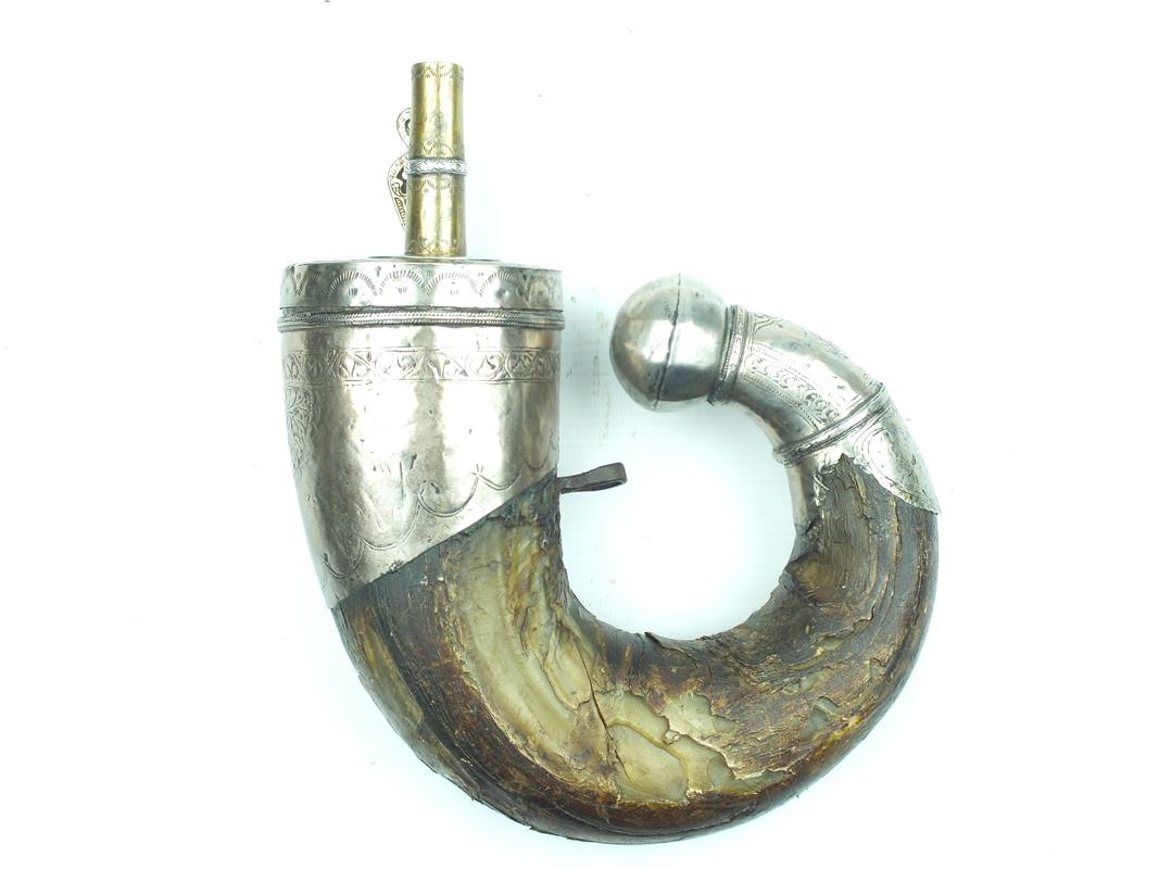 A Late 16th Century white metal mounted Mogul Powder Horn, the upper mount engraved with a scalloped