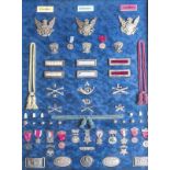 A framed and glazed collection of American Civil War and Indian War insignia and medals,