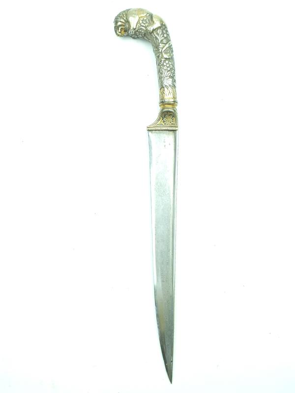A fine Indian kard with embossed lion's head pommel, 23cm T-section damascus blade with gold