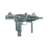 A deactivated mini UZI SMG, 20cm sighted barrel stamped with the serial no. 04996, folding stock,