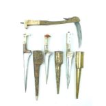 Three various Afghan Choora daggers, each with T-section blade, one with etched decoration,