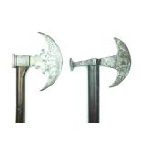 Two Sixteenth Century European axes, the first with 18cm diameter head with notched neck, the