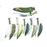 A small collection of Kukri, to include six examples, variously decorated in the Tibetan style, with
