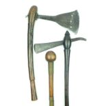 A group of African tribal weapons, comprising two axes, probably Congo, the first with broad head