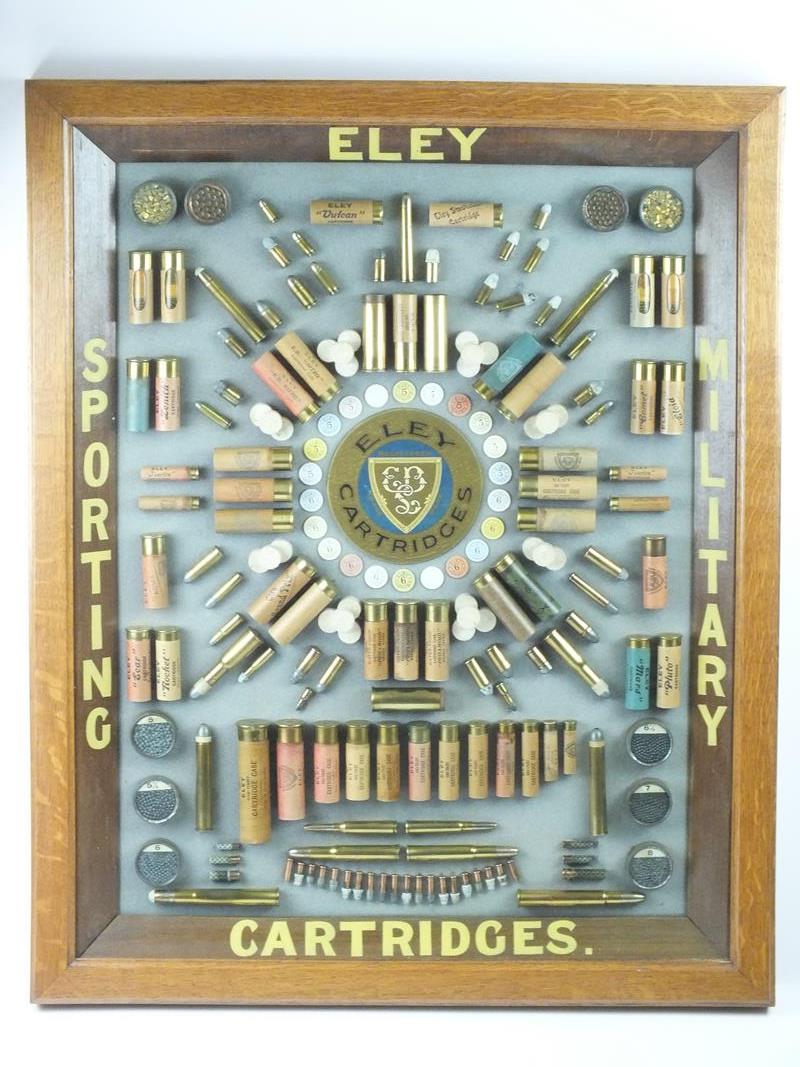 An Eley Sporting and Military Cartridges display board, the framed and glazed oak case with