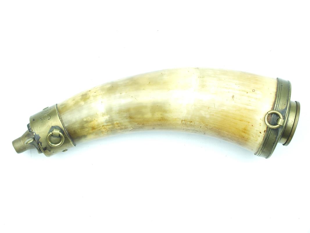 A Baker Rifle powder horn, the polished natural form body with brass mounts, the base with