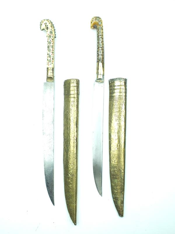 Two late 19th Century Balkan or Ottoman daggers, 23cm blade incised with a scroll, characteristic