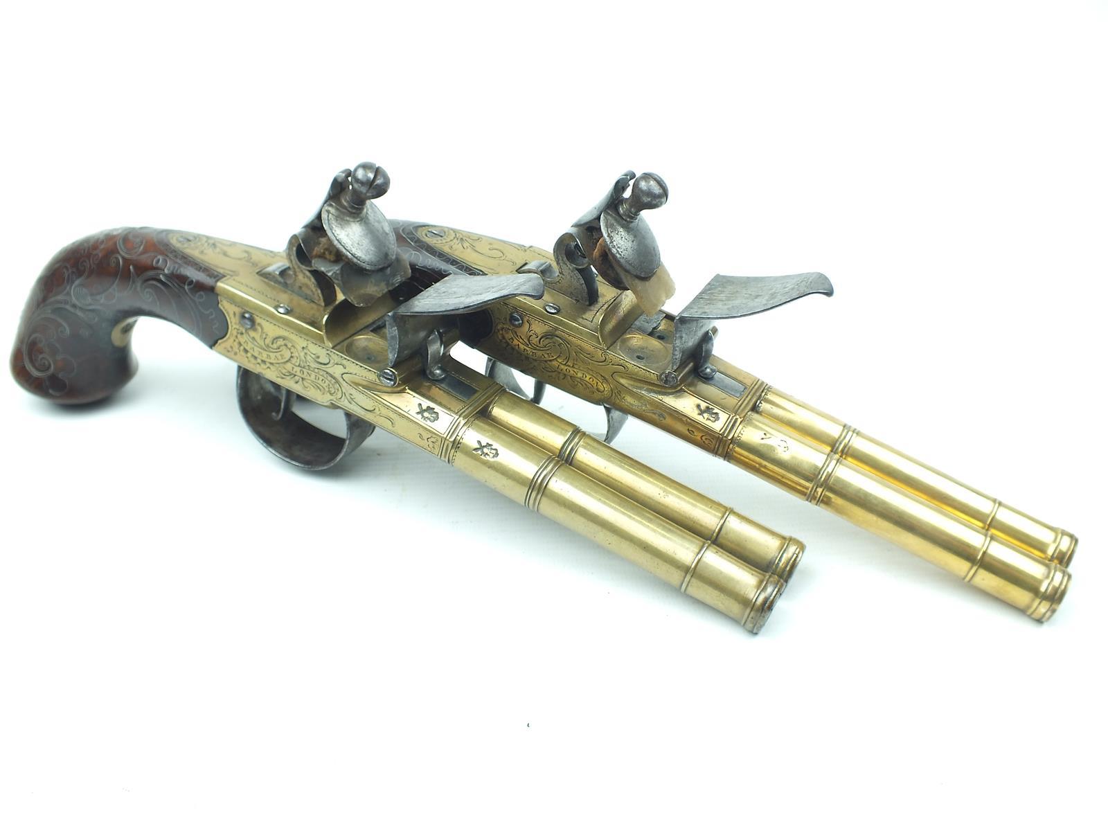 A fine pair of brass 54-bore flintlock Queen Anne double barrelled silver mounted coaching pistols