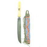 A bone handled knife with W. F. Cody beaded sheath, 6.75inch blade stamped UNIVERSAL L F & C,