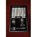 Boxed Birmingham hallmarked Christening gift set of egg-cup, spoon and napkin ring,