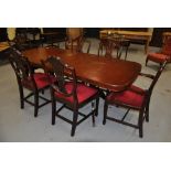Reproduction extending dining room table and matching chairs - including 2 carvers
