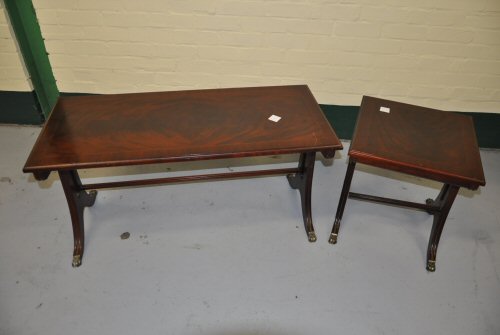 Reproduction mahogany finished part nest of occasional tables on splayed feet with brass paw