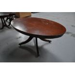 Oval mahogany finished occasional table on splayed legs