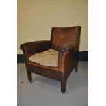 Edwardian studded leather upholstered armchair (in need of restoration)