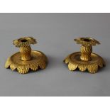 Pair of Austrian baroque candlesticks, chased copper, round base with central collumn and upper