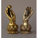 Pair of Buddha's hands, bronze cast with fine hand finish, one silvered and one gilded; on lotus