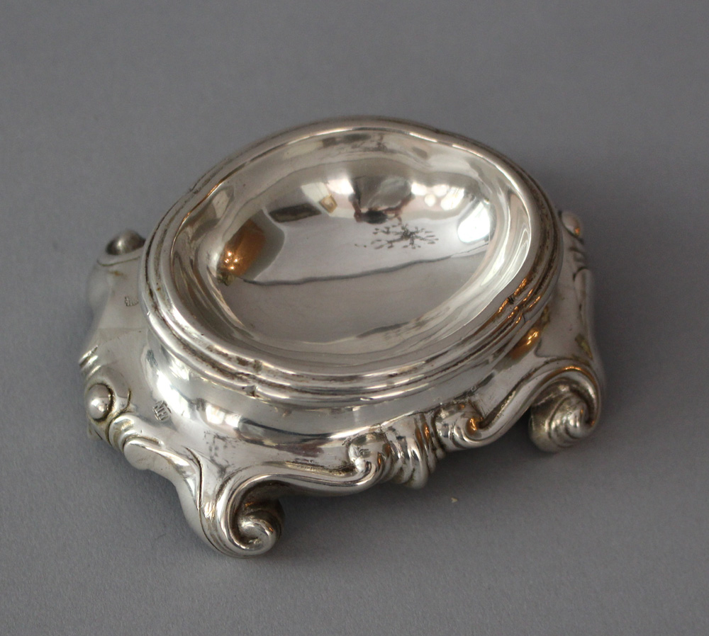 Augsburg silver salt bowl, oval form with shaped base in scroll ending, hand chased with Augsburg