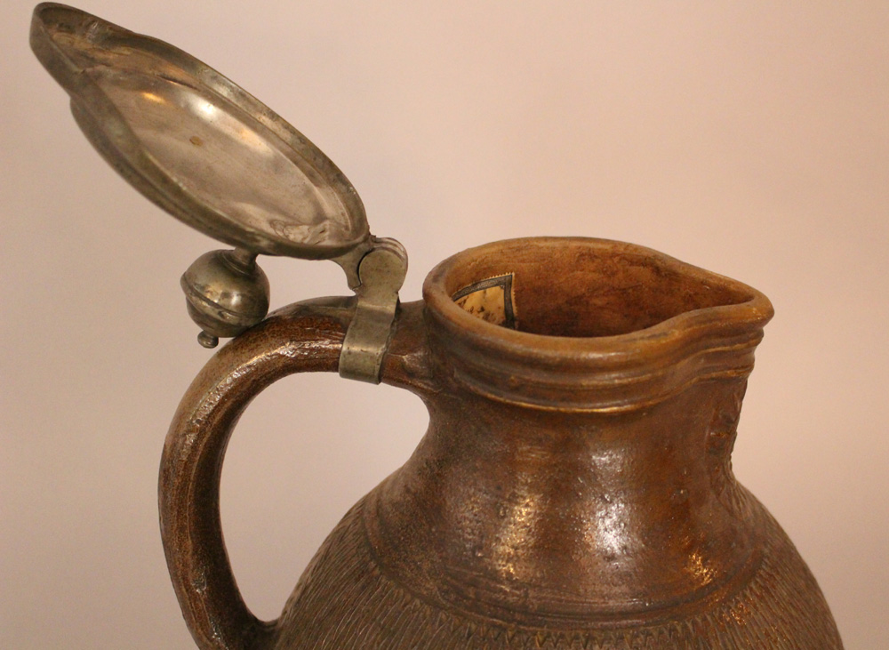 German apostles jug in shaped form with carved ornaments and the 12 apostles in half relief, in - Image 3 of 3