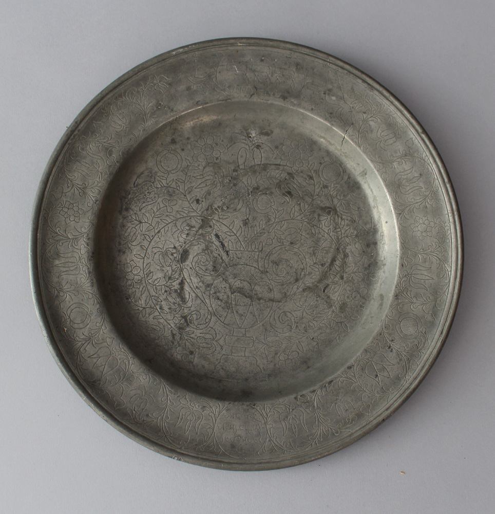 Jewish pewter seder plate with rich floral decorations, two animals holding an oval shield with