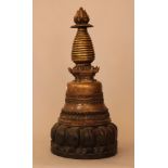 Tibetian pagoda with several decorations and on top a lotus flower with as well 13 rings; bronze