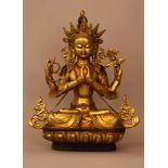 Tara in sitting possition on lotus base with hands folded and with flowers and rings crownd and with