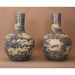 Pair of very large Chinese palace vases with long thin neck and round body; decorated with white