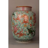 Monumental Chinese porcelain vase with highly decorative painted decorations of dragons, clouds