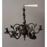 Small pewter chandlier with six branches and spouts, with open work decorations and volutes, stepped