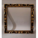 Italian Renaissance style frame; wood carved with volutes, flowers and ornaments, partly gilded,