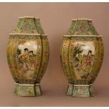 Pair of Chinese Famille Rosé style porcelain vases with coart ladies in the centre surrounded by