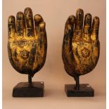 Pair of Asian Buddha's hands, naturalistic wood carving and gilding, in the certre of the hand a