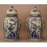 Pair of large Chinese porcelain palace vases; round cilindrical form with porcelain lids and knob