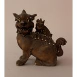 Asian terracotta female lion with child; hand sculpted and decorated with very fine hairs, glass