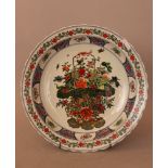 Chinese porcelain dish, round form with multicoloured flower bunch in the centre, surrounded by