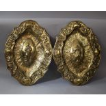 Pair of Neapolitan bronze plates in shaped form with rich chased baroque floral ornaments, in the