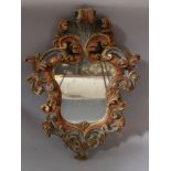 Florentine Renaissance style mirror, wood carved with achantus leaves decorations and painted in