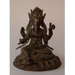 Indian elephant goddness with four hands holding ritual objects and sitting on an integrated base;