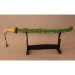 Chinese sword of a honorable person or officer, possibly a court member, with white and yellow