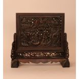 Chinese table paravent with carved figural and ornamental decorations, partly in open work; shaped