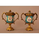 Pair of French porcelain vases with porcelain lid, decorated with multicoloured flowers on white