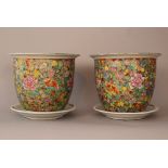 Pair of Chinese porcelain flowerpots with multicoloured flower painted decorations, glazed, with two