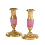 A pair of Charles X Ormolu and Gorge de Pigeon glass candlesticks