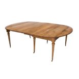 A French provincial walnut extending dining table