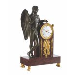 An Empire ormolu patinated bronze and rose griotte marble mantel clock