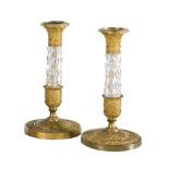 A pair of Charles X Ormolu and cut glass candlesticks