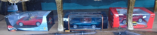 Three Die Cast Models of Cars to Include a Jaguar, a Ferrari and a Chrysler.
