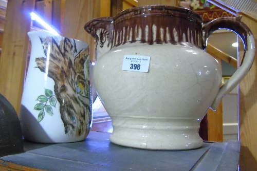 A Large Brown Glazed Jug with Mask Spout, and a modern jug (2).