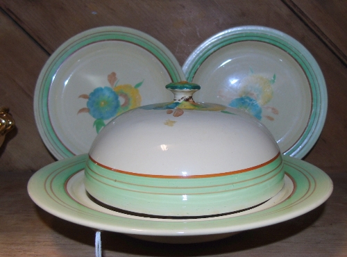 A Pair of Wilkinson Clarice Cliff Plates & Similar Muffin Dish.