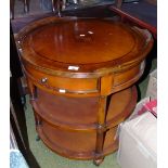 A 20th Century Drum Table with Inlaid Top on Castors, together with a nest of three tables & a