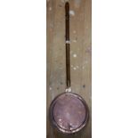 A 19th Century Copper Warming Pan with wooden handle.